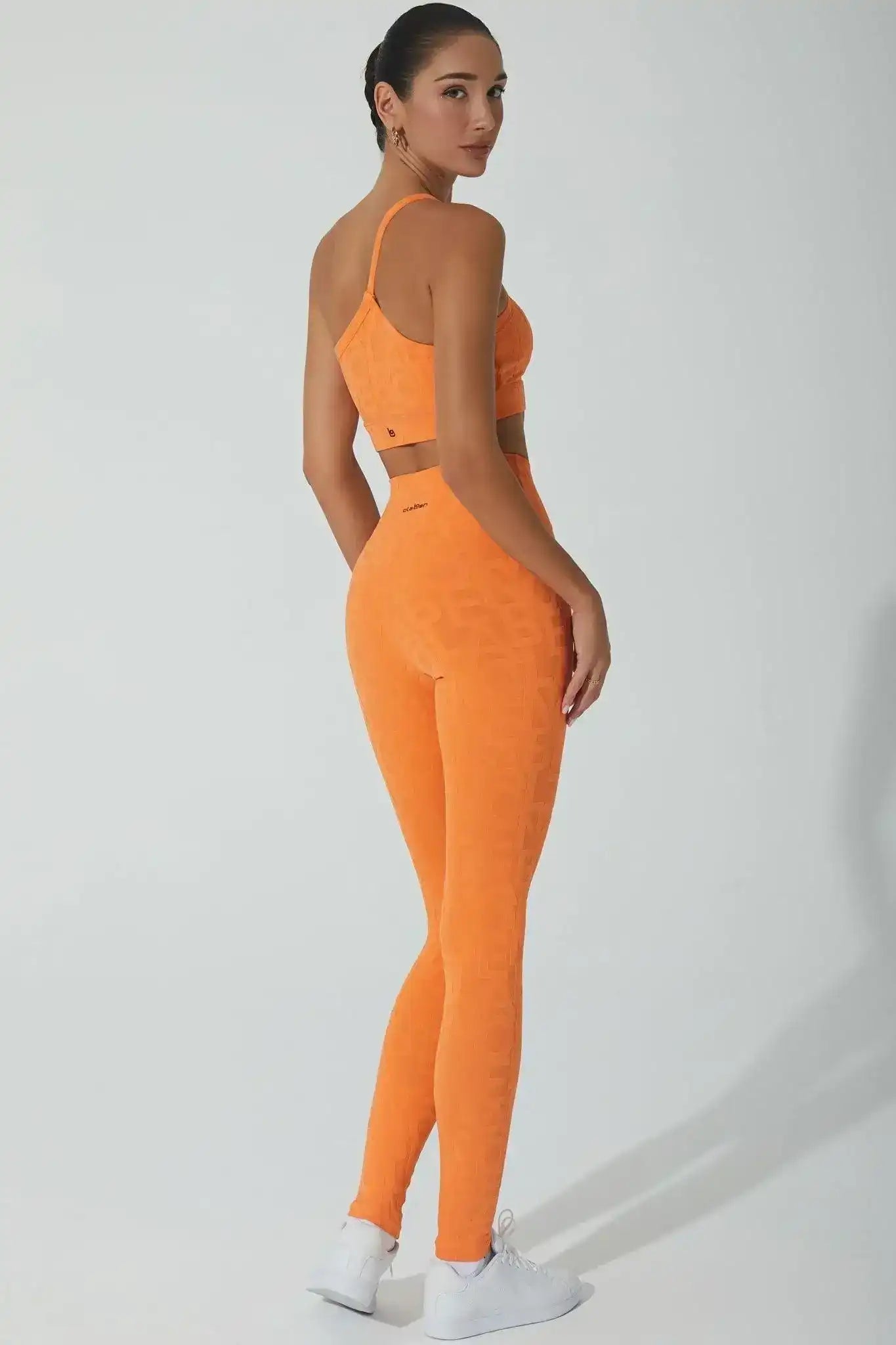 Olaben Classic Déese Fleur Legging 3D in Sunset orange — 3D embossed activewear, lifestyle hero shot