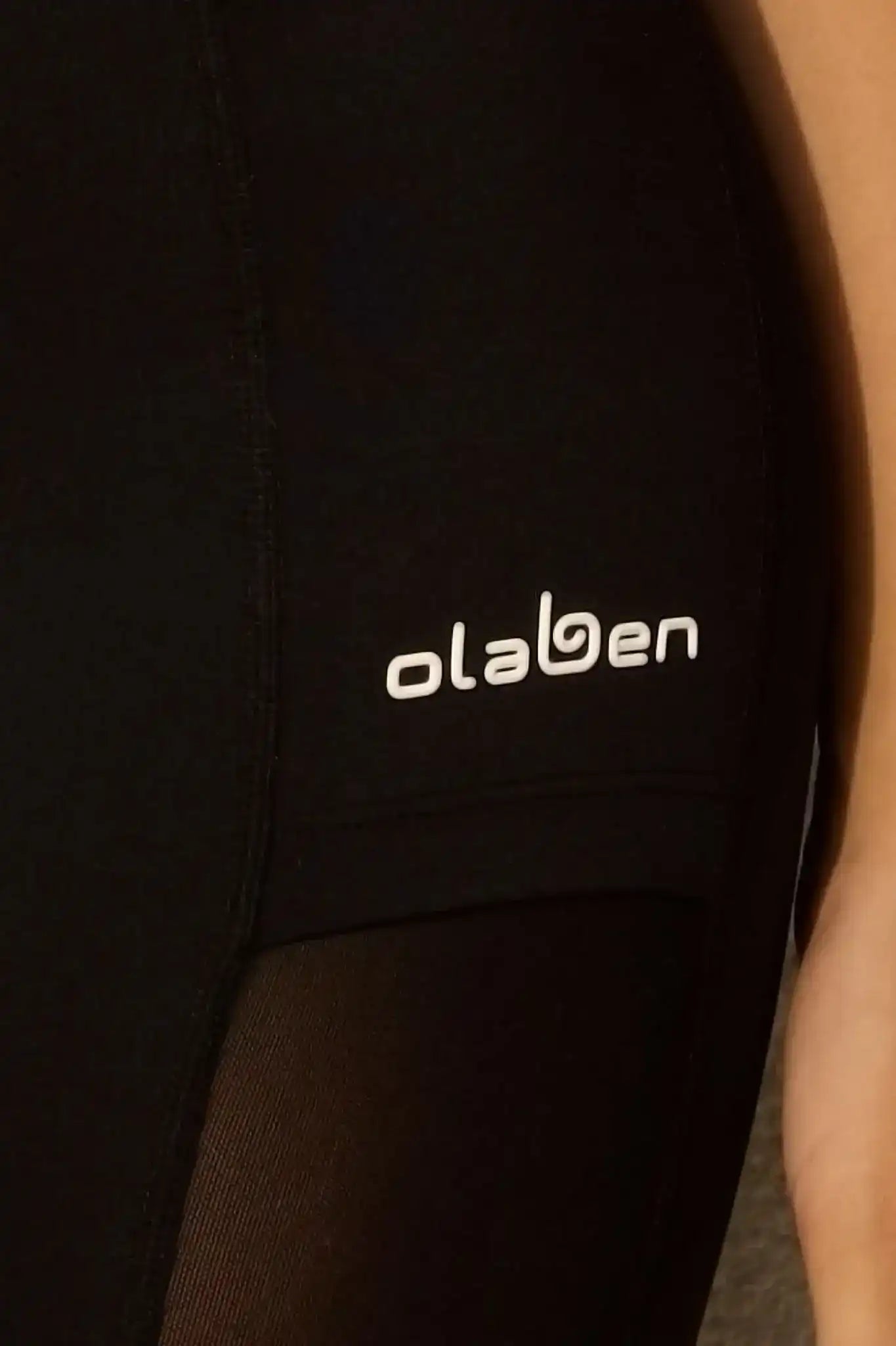 Black Olaben activewear with white logo, stylish and functional fitness gear
