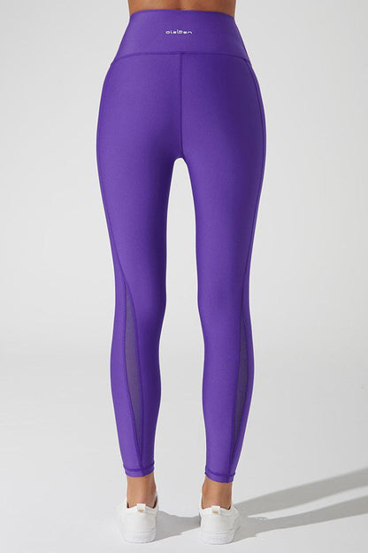 Royal purple women's leggings with Clarita mesh design, perfect for a stylish workout or casual wear.