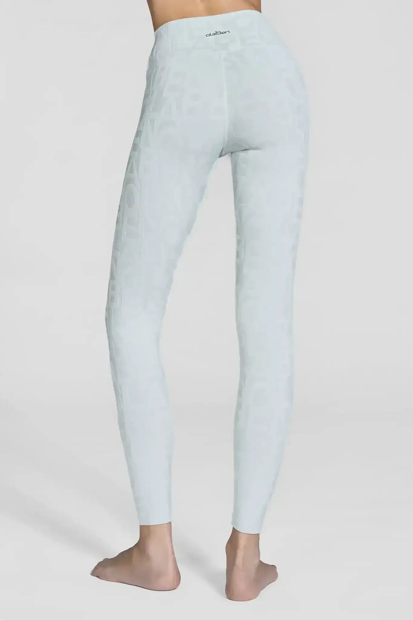 Model in matching Olaben Classic Déese Fleur 3D set — Mint Cream embossed leggings and tank top, full-body 3/4 studio shot