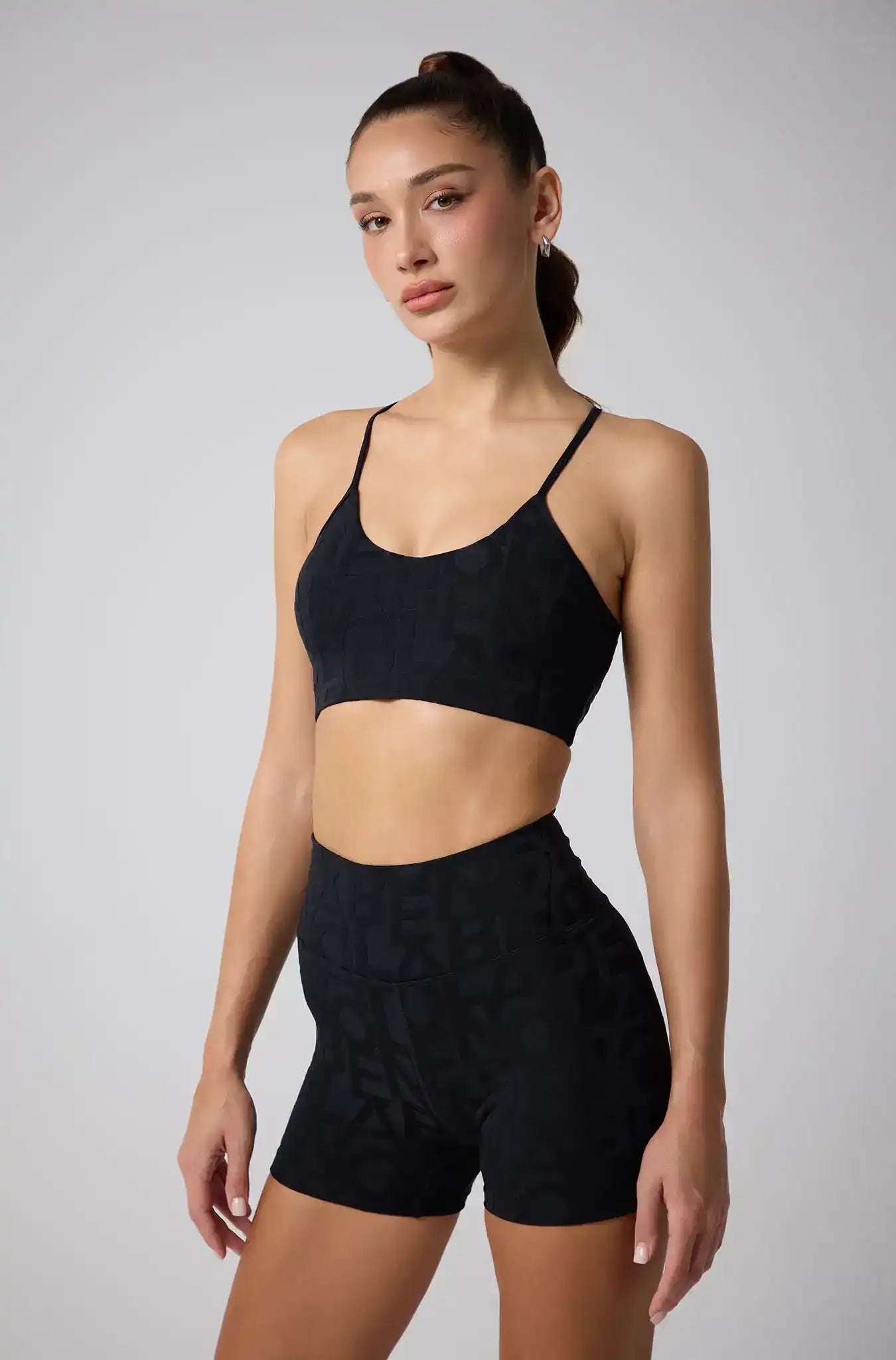 Side view of Olaben Classic Lumière Bra 3D in Coal black — 3D embossed bra, studio shot