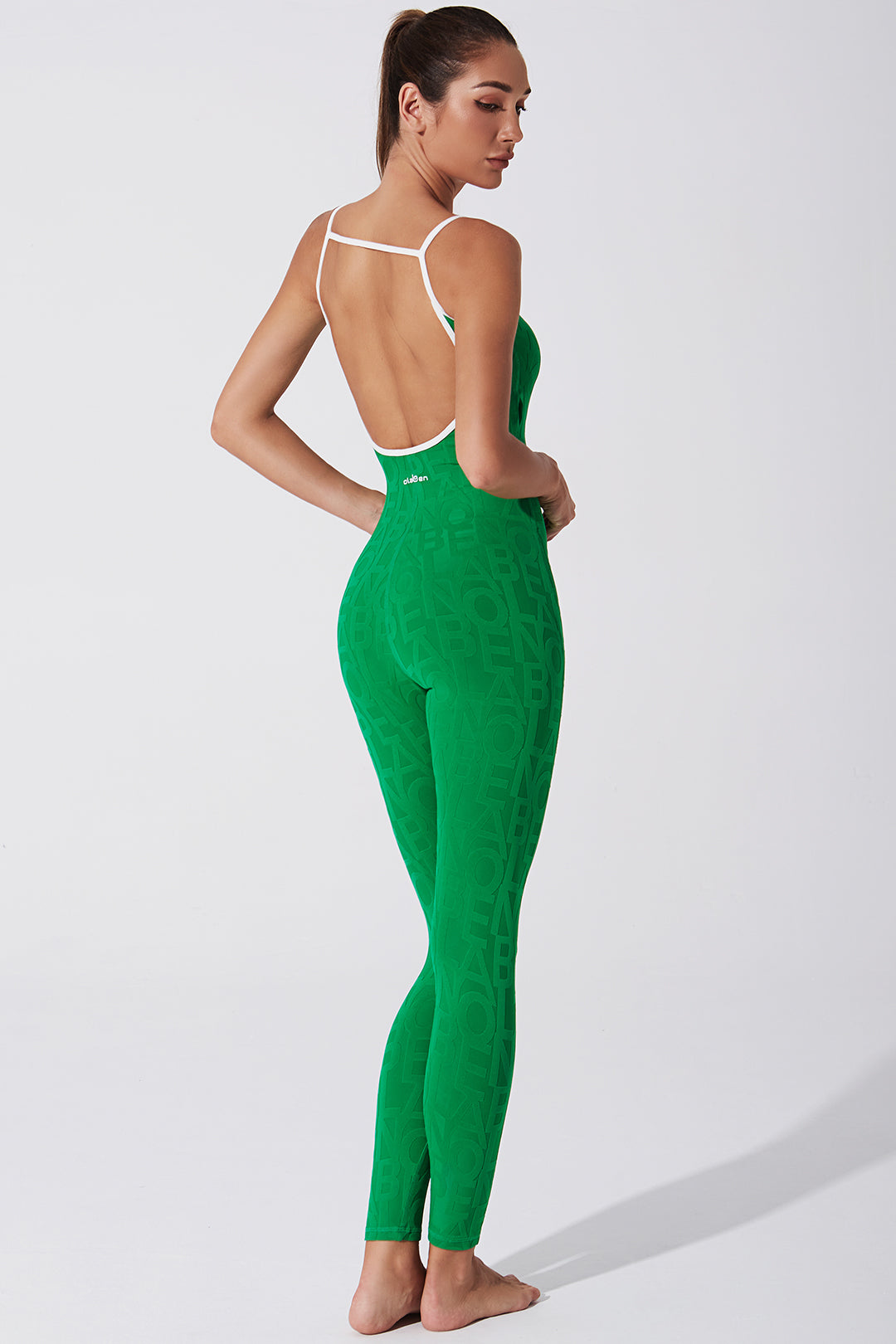 A stylish women's jumpsuit in dark green color.