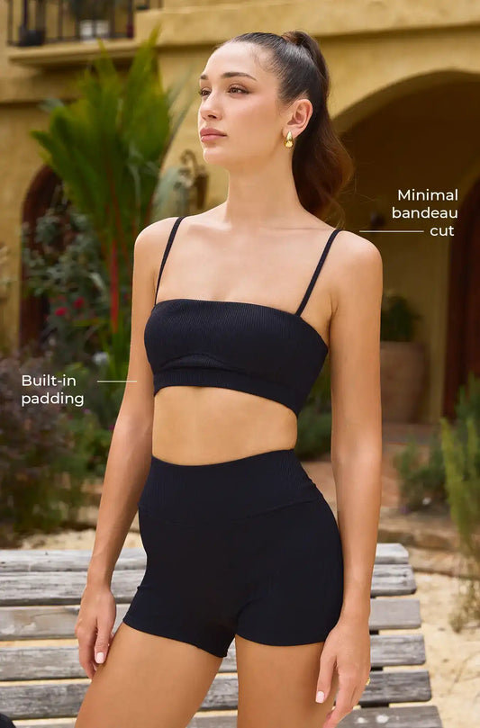 Black ribbed activewear set with built-in padding and minimal bandeau cut, perfect for yoga and fitness.