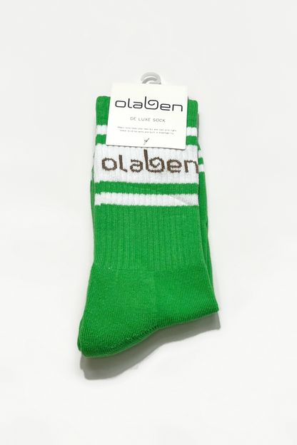 Pair of green socks with fern pattern, quarter length, cozy and comfortable.