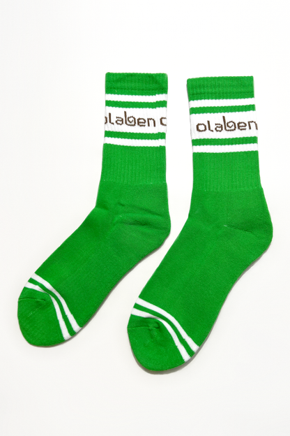 Pair of green socks with fern pattern, quarter length, cozy and comfortable.