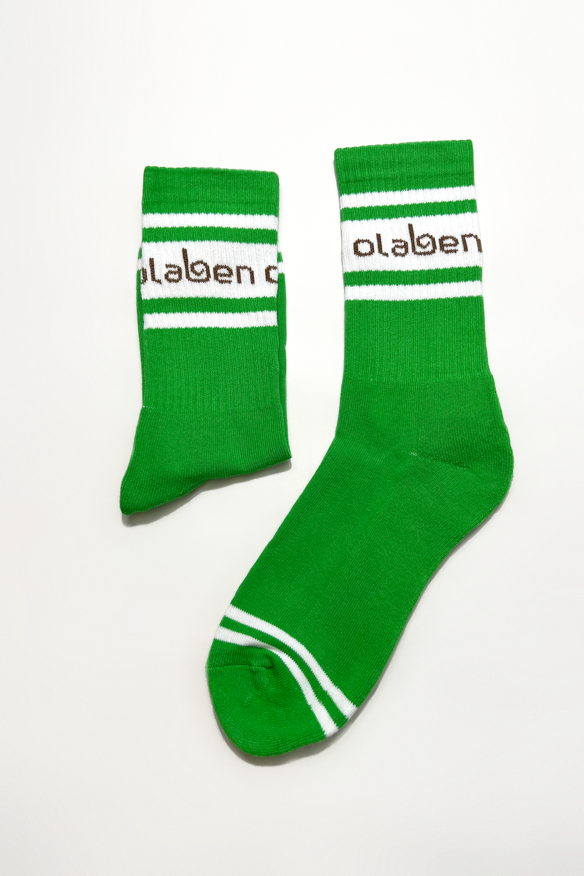 Pair of green socks with fern pattern, size 1-5, in a cozy quarter length.