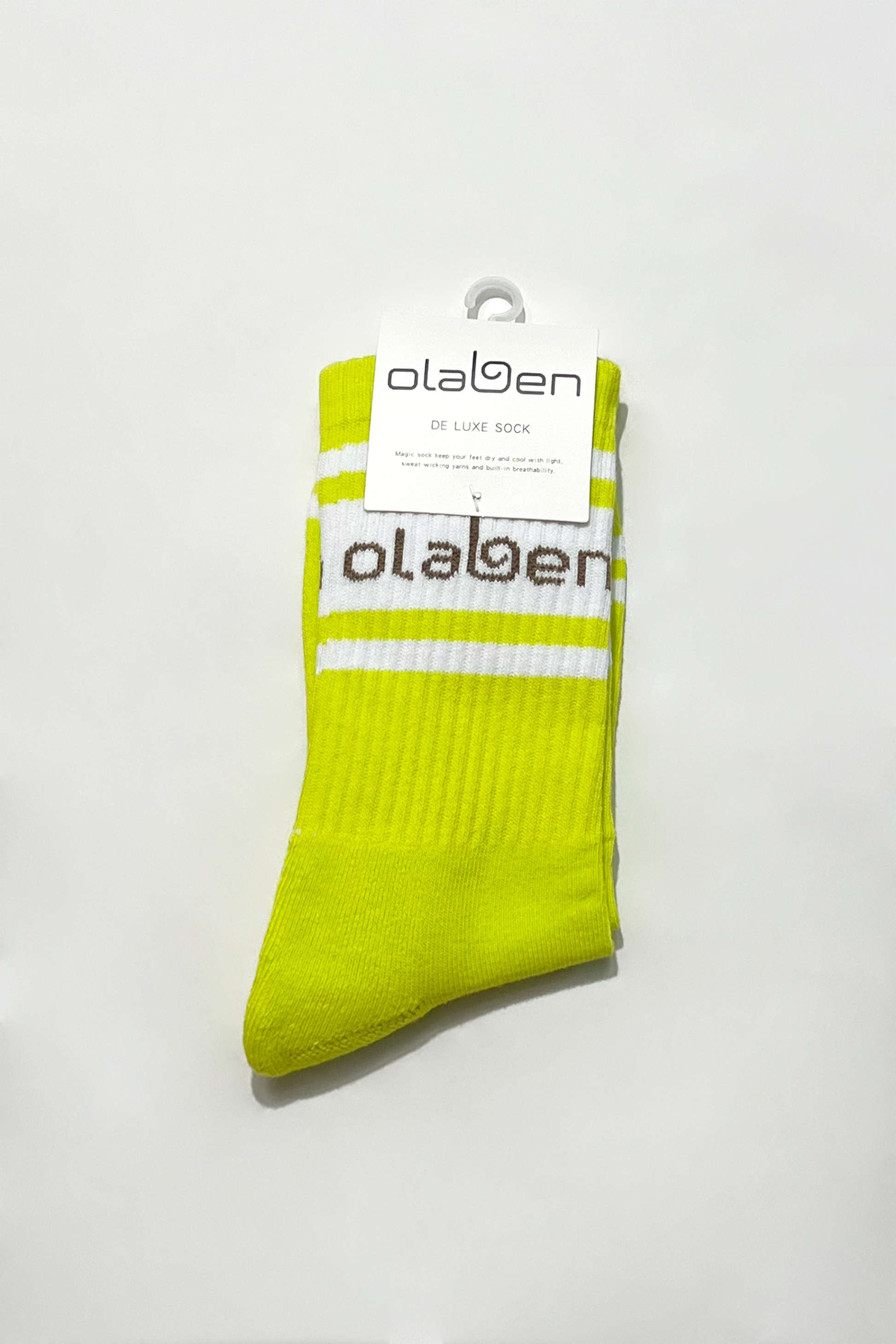 Colorful assortment of socks and lemon tonic in yellow, perfect for cozy quarters.