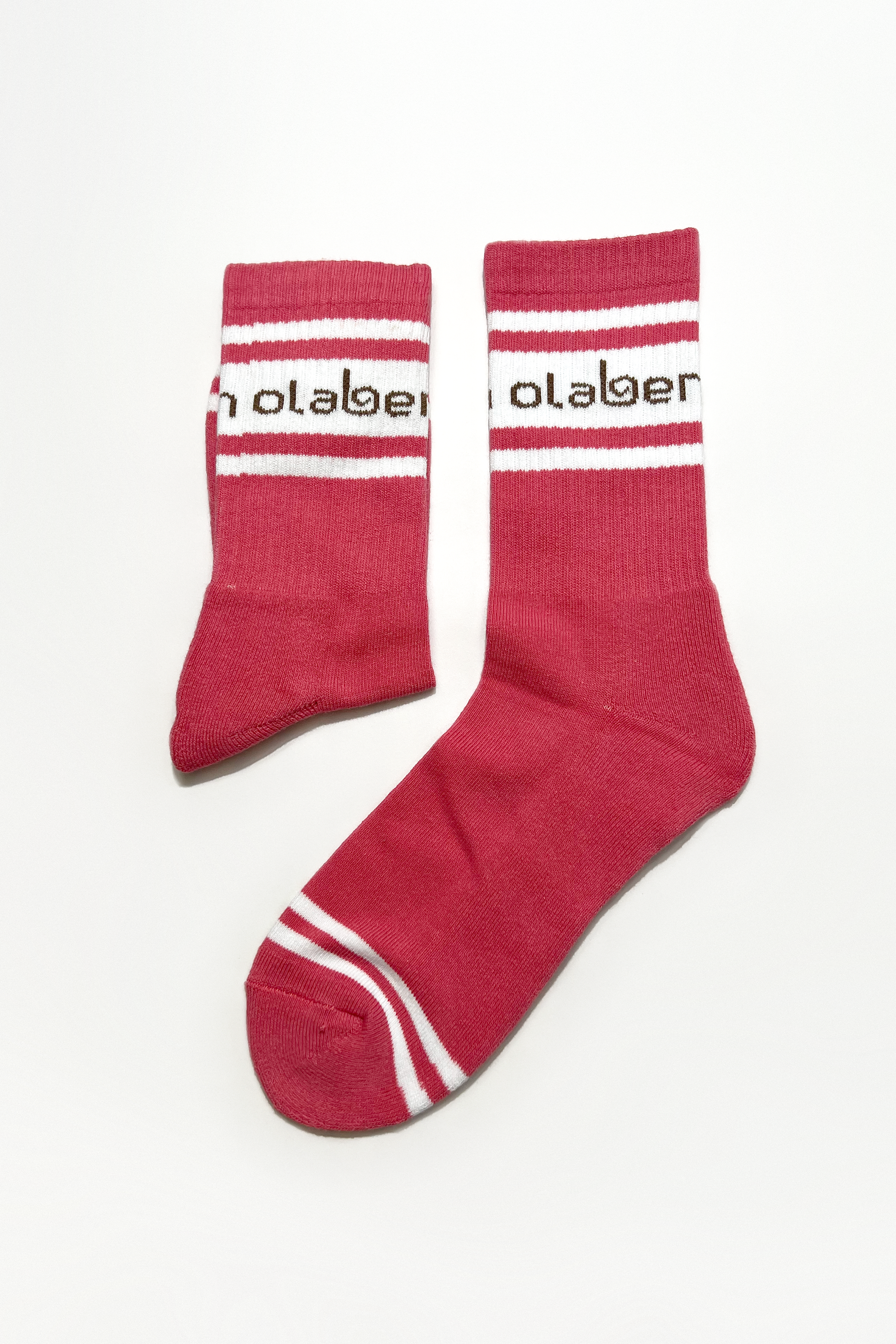 Colorful assortment of cozy quarter socks in raspberry wine and pink shades.