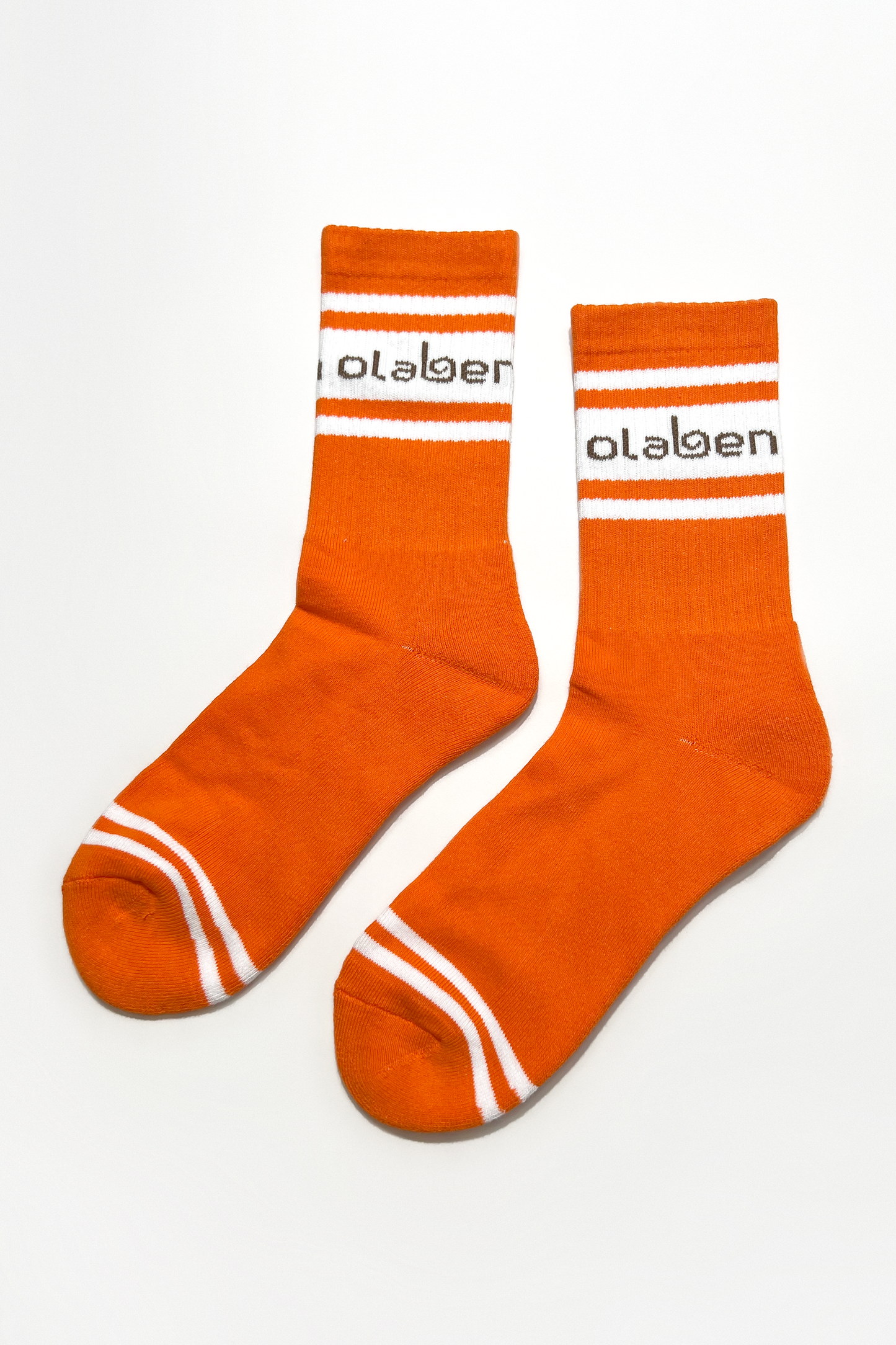 Colorful assortment of cozy quarter socks in sunrise orange, perfect for everyday wear.