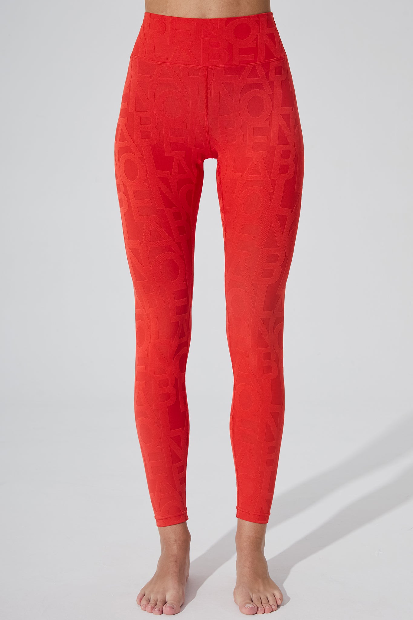 Haute red women's leggings with a 3D fleur pattern.