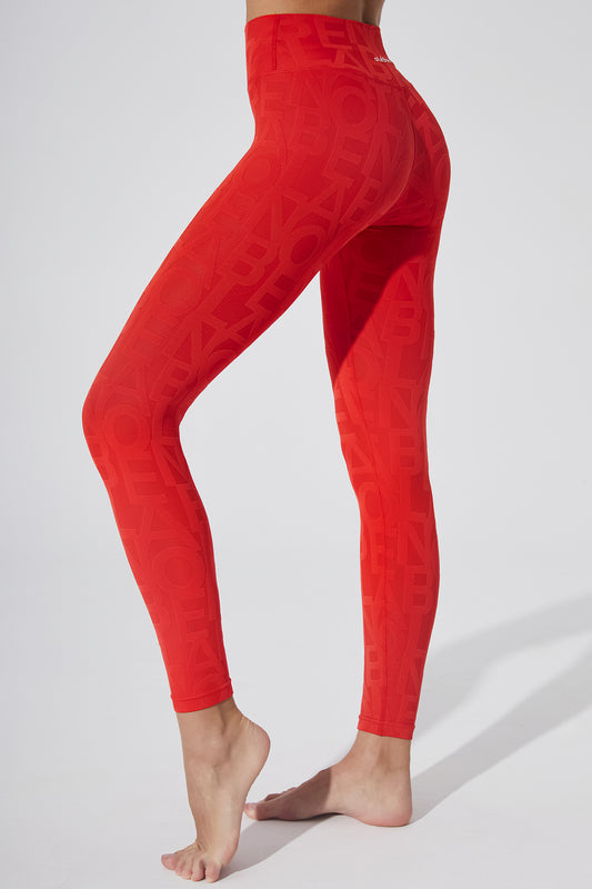 Haute red women's leggings with a 3D fleur pattern.