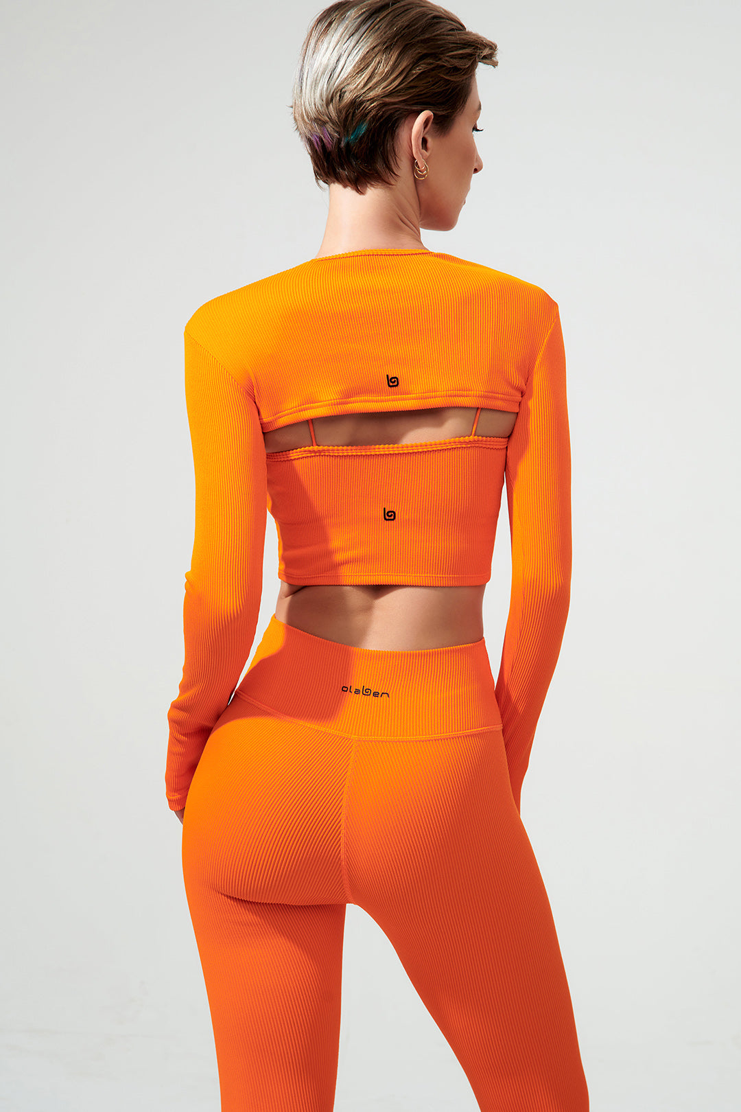 Vibrant tangerine orange women's long sleeve shirt with envy design, perfect for any occasion.