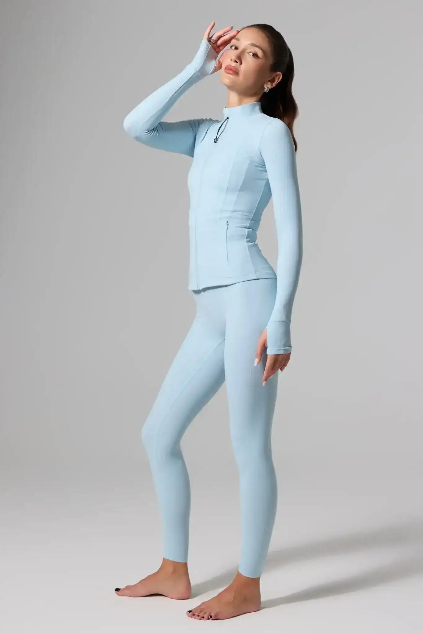 Olaben Evo High Rise Leggings in Glacier Blue — lifestyle shot, sculpting high-waist legging on model