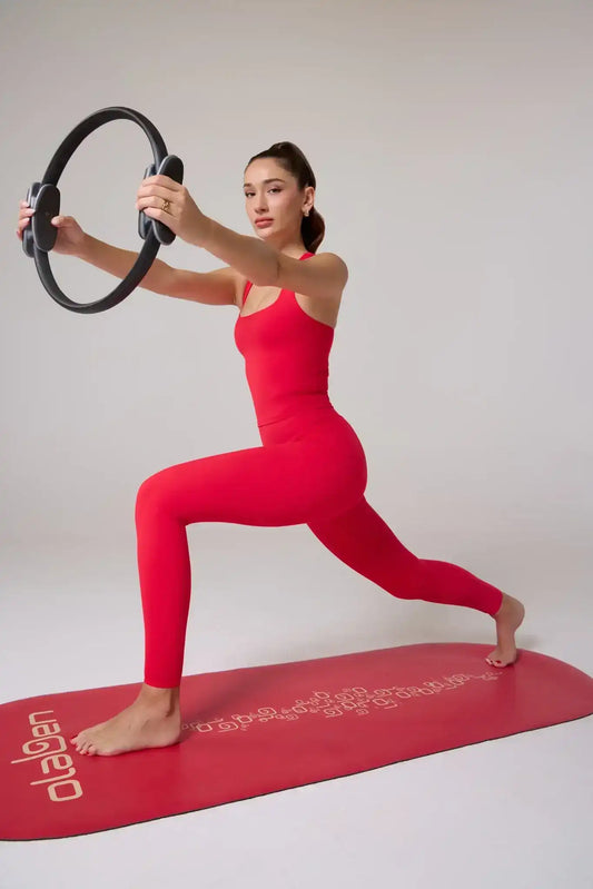 Olaben Evo High Rise Leggings in Lava red — lifestyle shot, sculpting high-waist legging on model