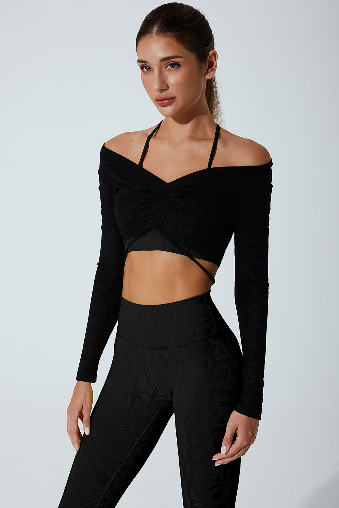 Black drawstring long sleeve women's top with a stylish and comfortable design.