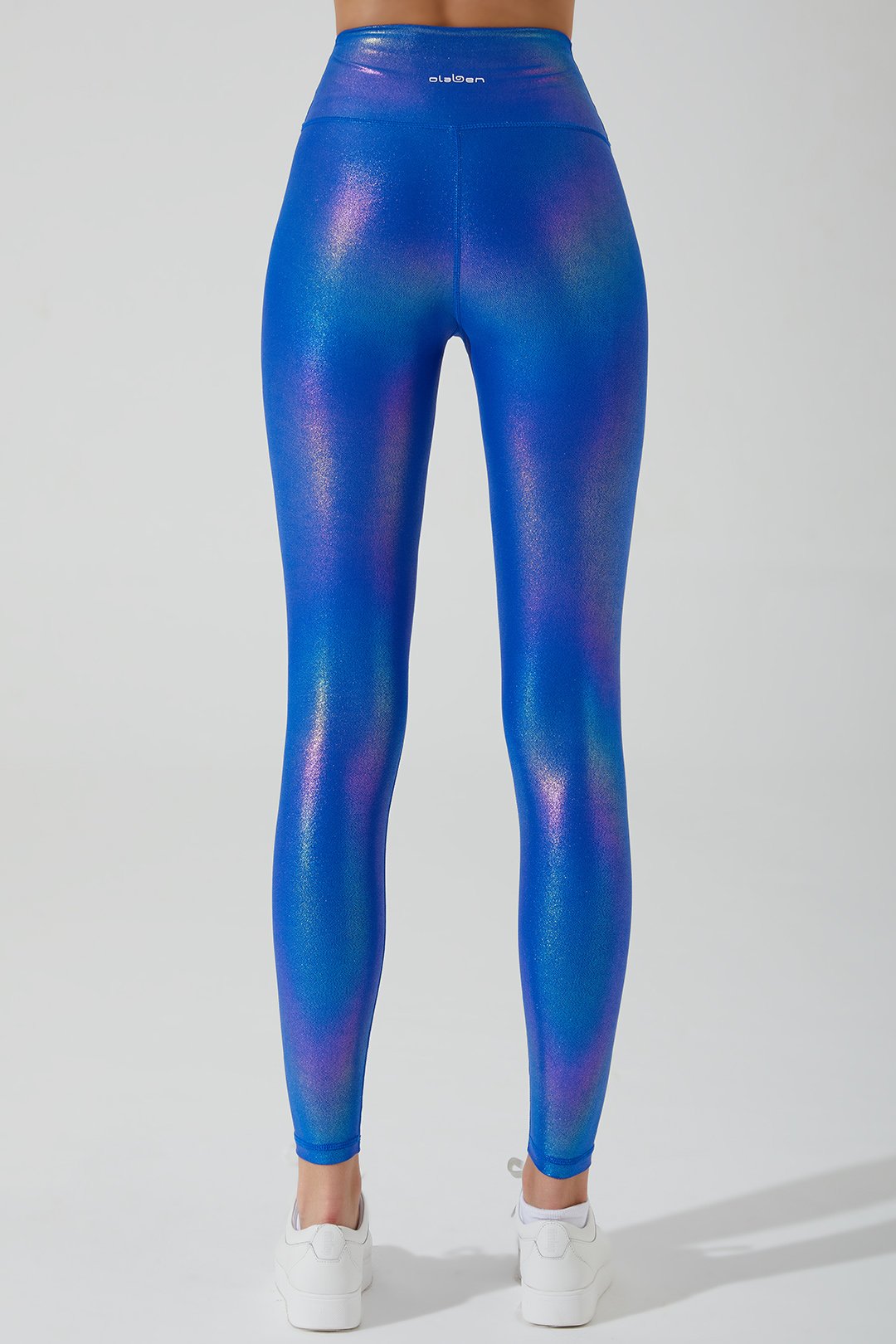 Stylish women's magnetic blue leggings with an iridescent finish, perfect for a trendy look.