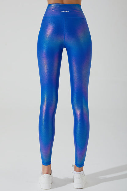 Stylish women's magnetic blue leggings with an iridescent finish, perfect for a trendy look.
