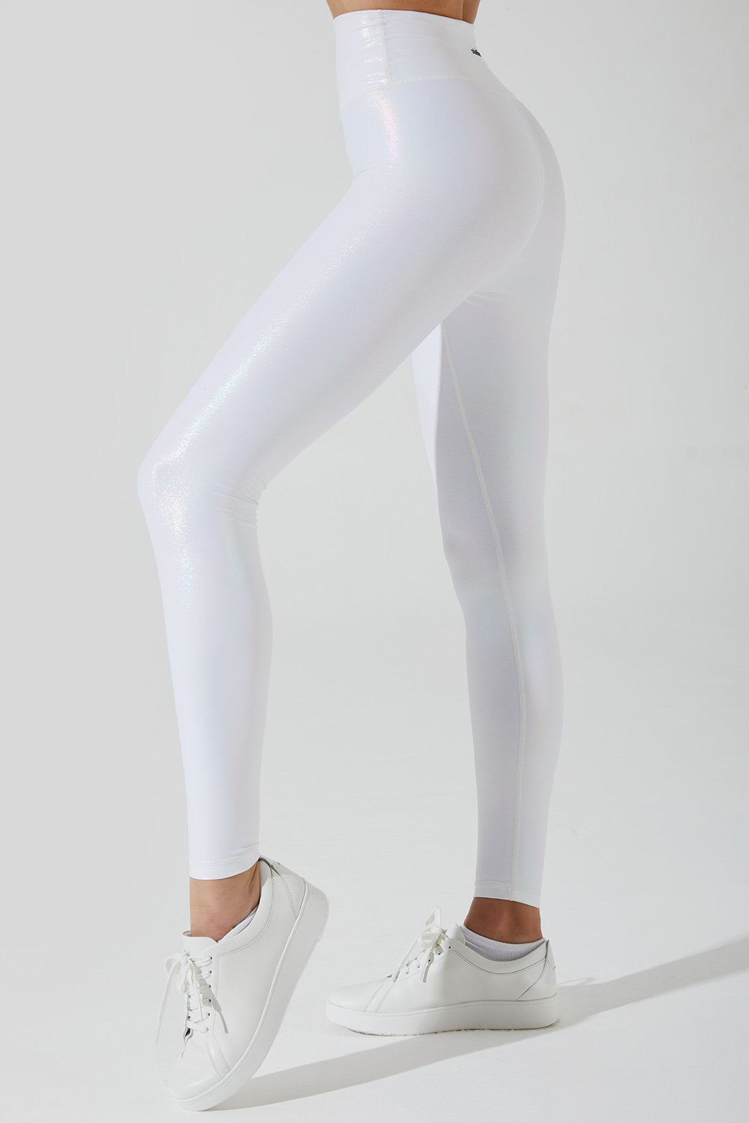 Stylish snow white women's leggings with an iridescent finish, perfect for winter fashion.