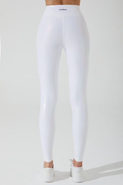 Stylish snow white women's leggings with an iridescent finish, perfect for a fashionable winter look.