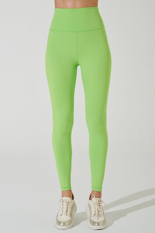 Fluorescent green women's leggings with a unique design, perfect for active wear and fashion.