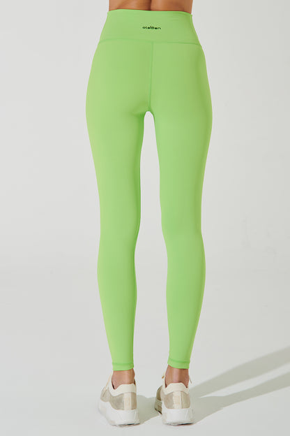 Fluorescent green women's leggings with a unique design, perfect for active wear and fashion.