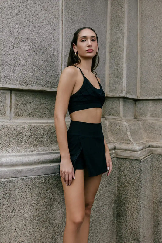 Front view of Olaben Lani Monogram Bra in Black — monogram-print bra, studio shot