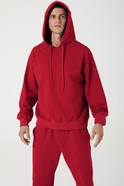 Vibrant magenta red men's hoodie with a cropped style, perfect for a trendy look.