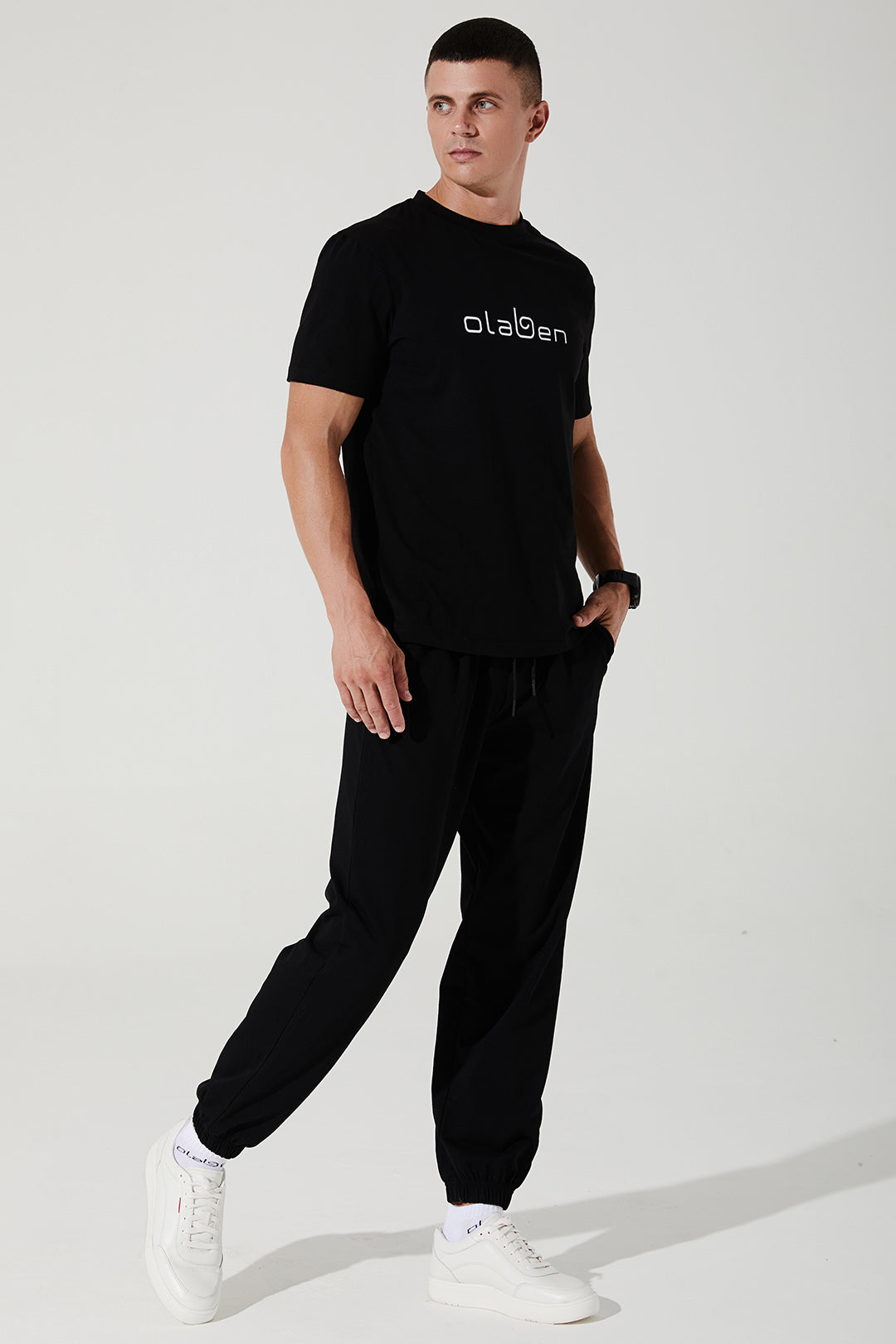 Black men's sweatpants and trousers for Janet, style OW-0034-MTR-BK, in size 4.