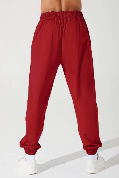 Vibrant magenta red sweatpants for men, perfect for a comfortable and stylish look.