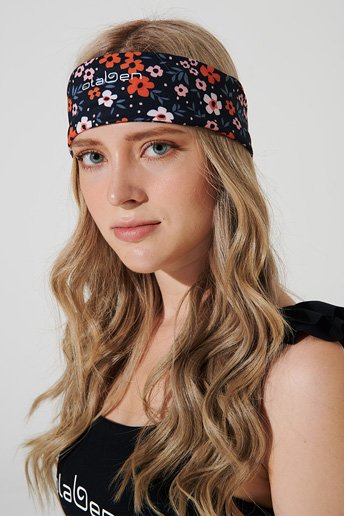 Orange Maja headband with vibrant color, perfect for adding a stylish touch to your outfit.