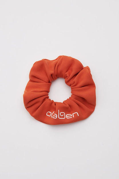 Medium carmine orange scrunchie headwear for women, perfect for adding a pop of color.