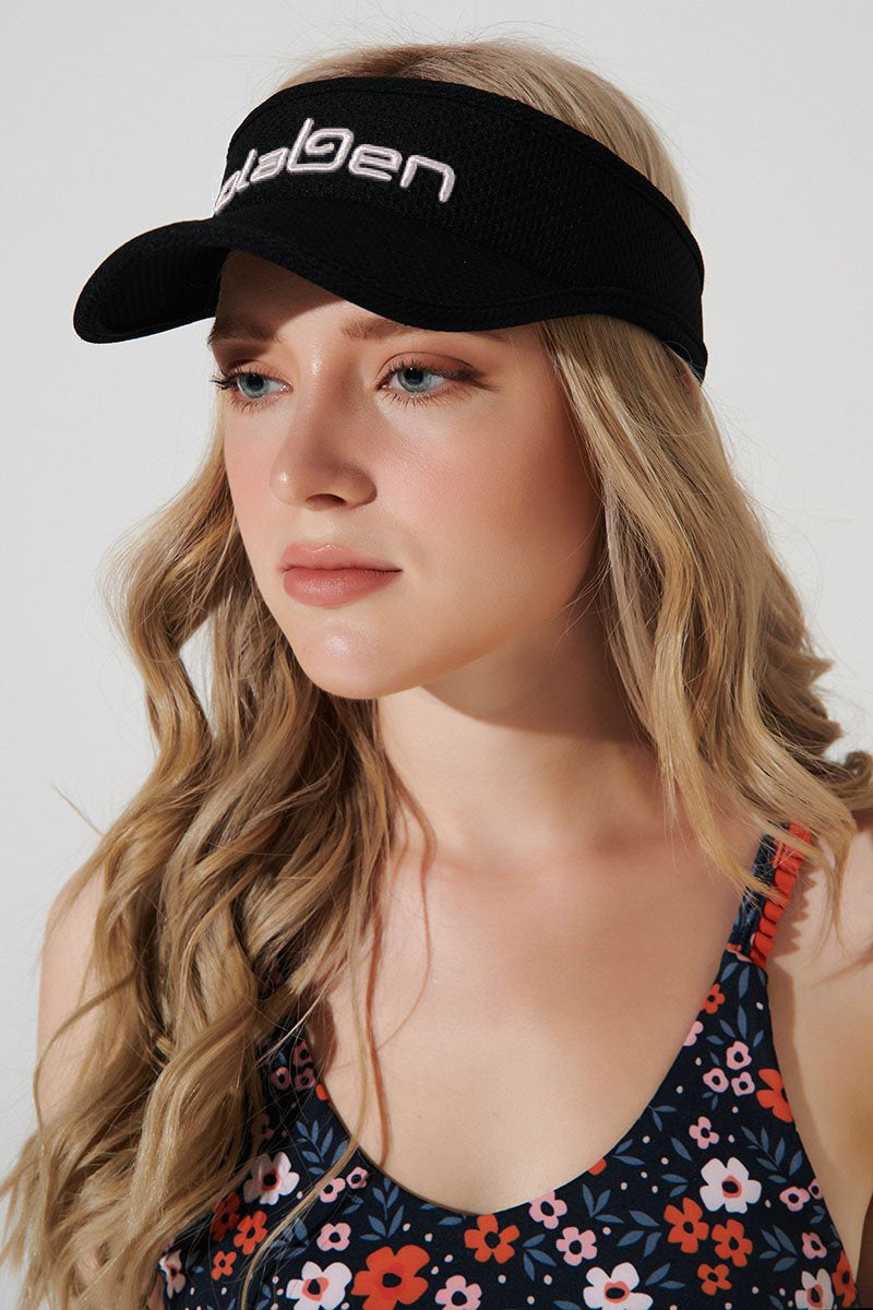 Black visor cap with headwear design, perfect for a stylish and trendy look.