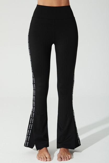 Black women's leggings with OlaBen Ylang logo, perfect for any occasion.