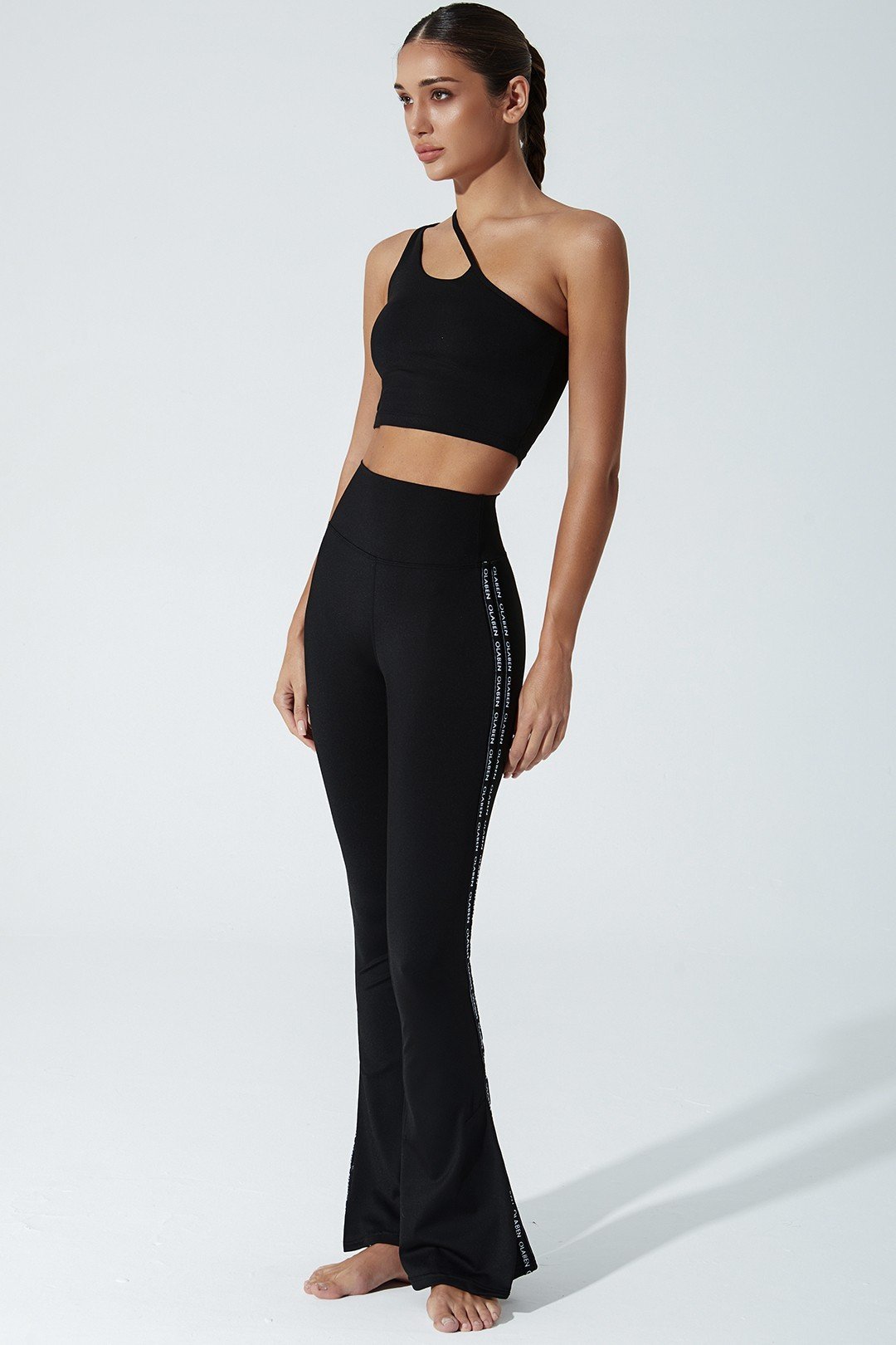 Black women's leggings with OLABEN YLANG logo, perfect for any stylish outfit.
