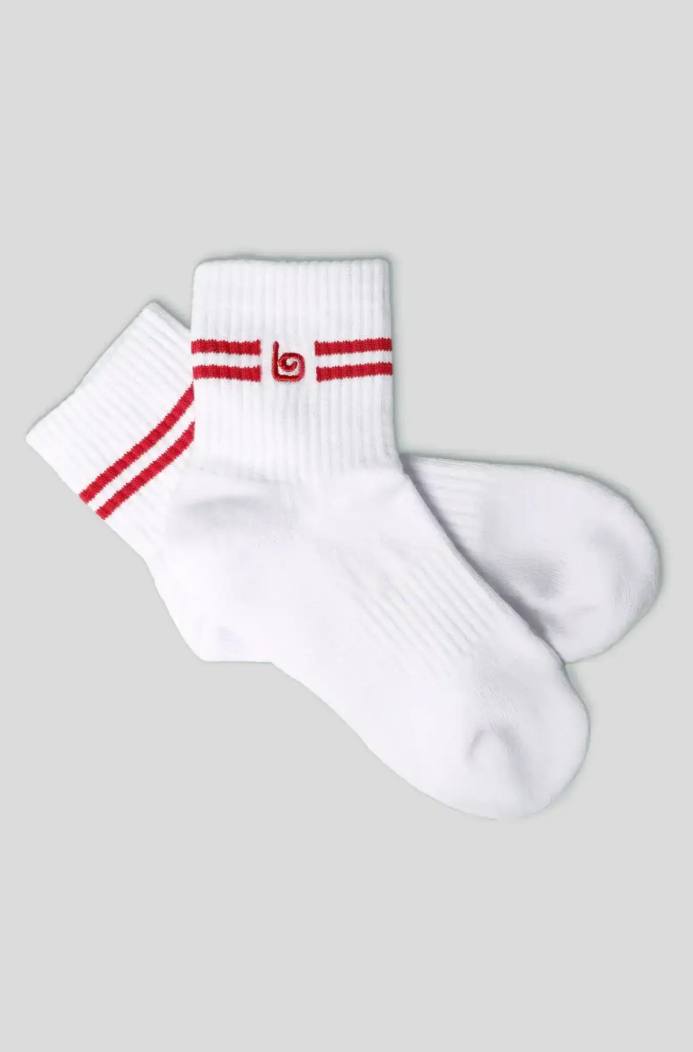 White athletic socks with red stripes and logo, ideal for fitness and active wear