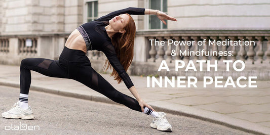 Woman in black activewear doing yoga stretch outdoors, promoting meditation and mindfulness