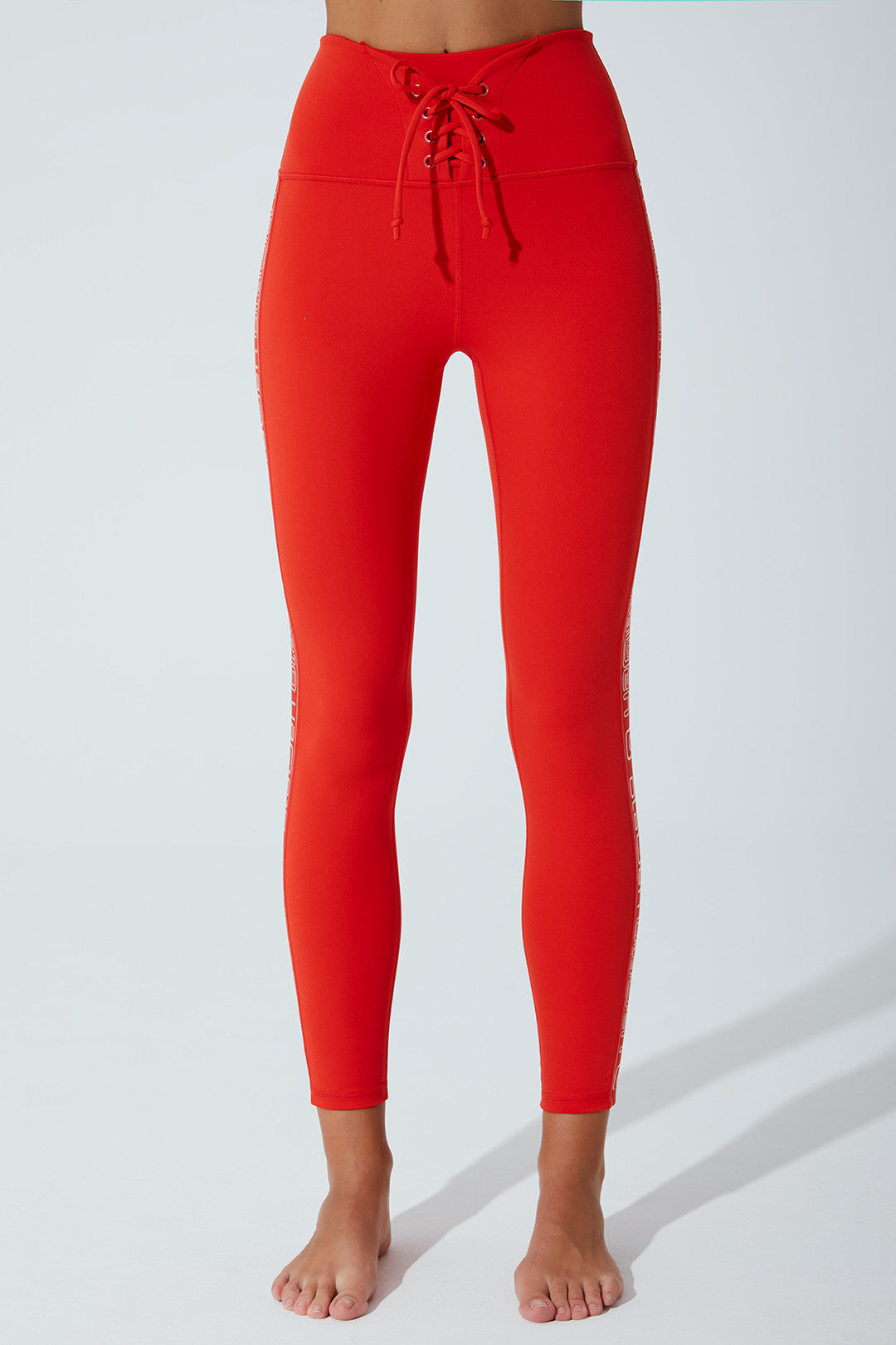 Red high-waist double knot leggings for women, perfect for a stylish and comfortable look.