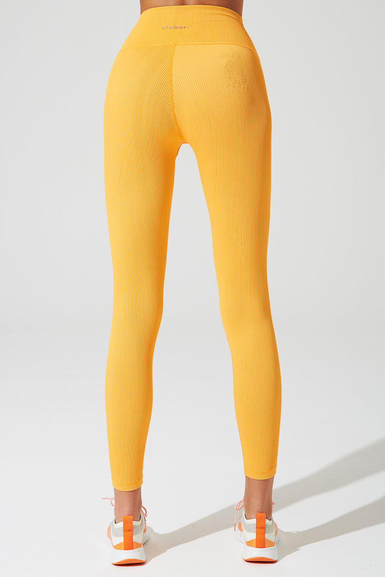 Vibrant saffron orange high-waist ribbed leggings for women, perfect for a stylish workout ensemble.