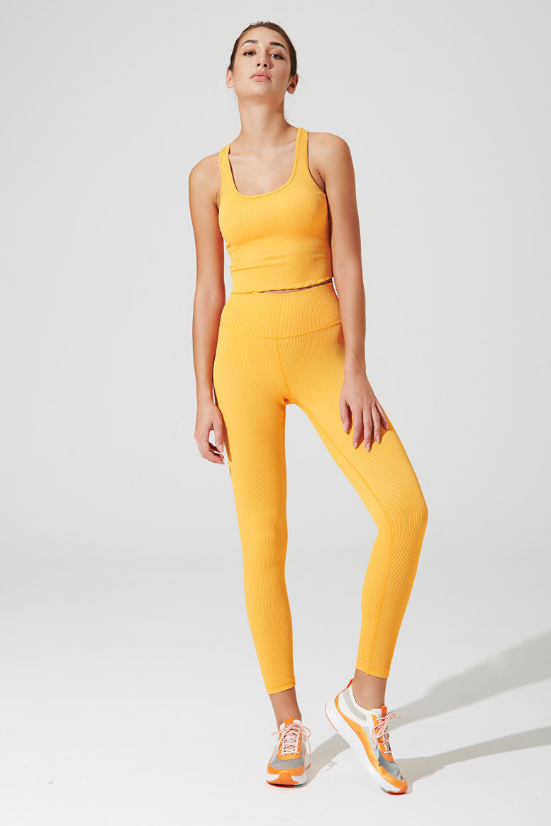 High-waist ribbed saffron orange leggings for women, perfect for a stylish and comfortable look.