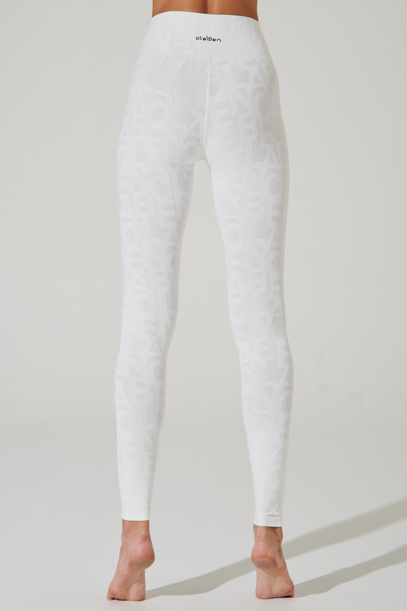 White snowflake patterned leggings for women, size 4, perfect for winter fashion and comfort.