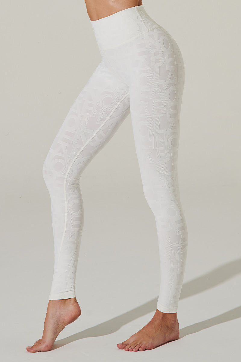 White snowdrift leggings with a unique design, perfect for a stylish winter look.