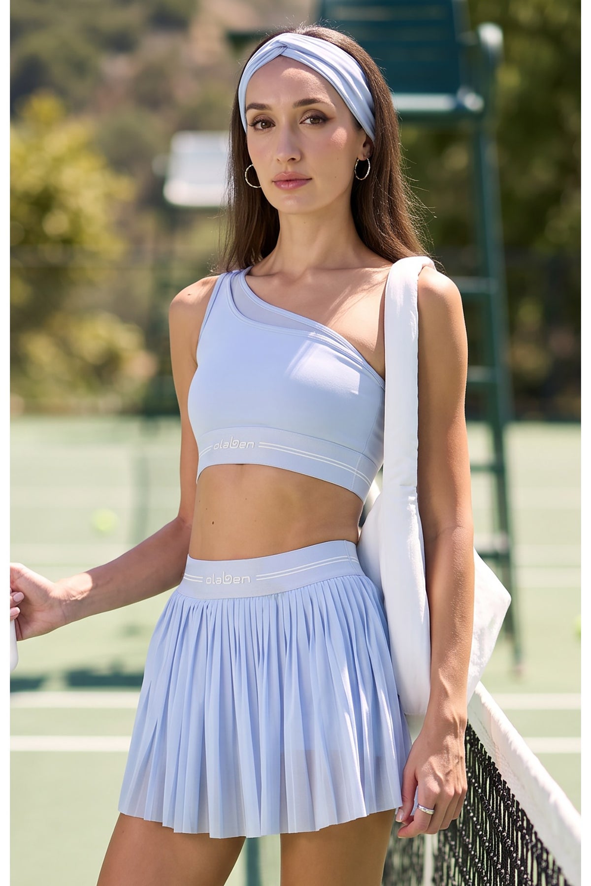 Olaben Asymm Offshoulder Bra in Mist, front view with matching pleated skirt