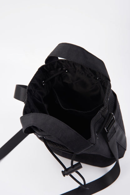 Black bucket bag with black accents, style OW-0146-UBA-BK, displayed in a high-quality image.