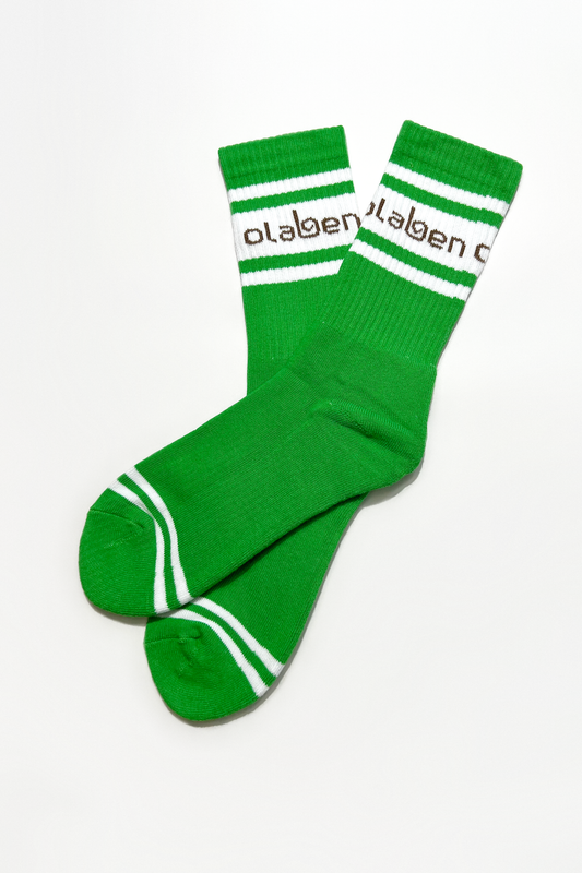 Pair of green socks with fern pattern on a cozy quarter length, OW-0151-USO-GN.