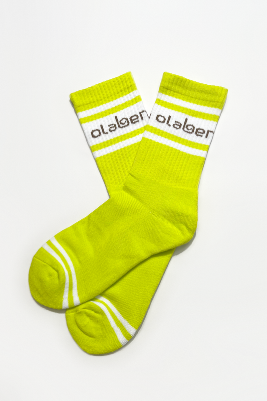 Colorful assortment of socks and lemon tonic in yellow, perfect for cozy quarters.