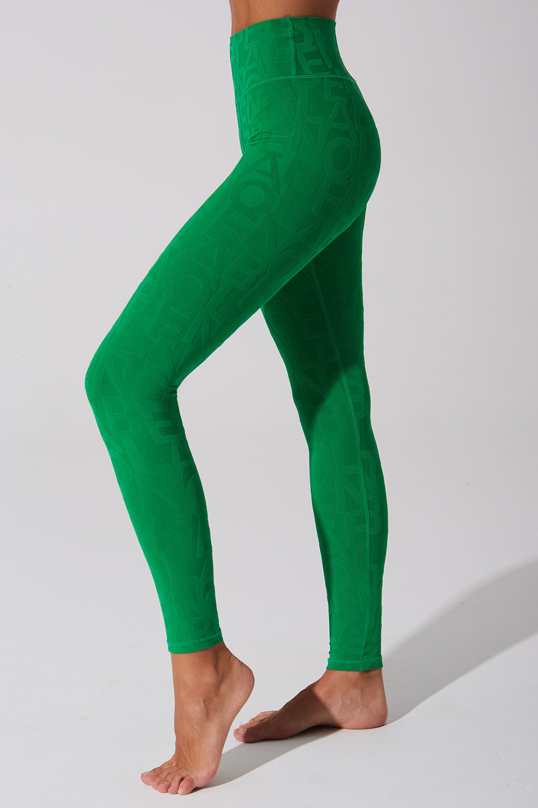 Dark green women's leggings with a 3D fleur pattern.