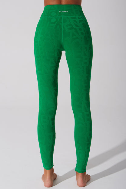 Dark green women's leggings with a 3D fleur pattern.
