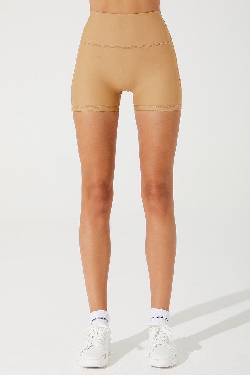 Beige cappuccino women's biker shorts with an elegant design, perfect for a stylish look.