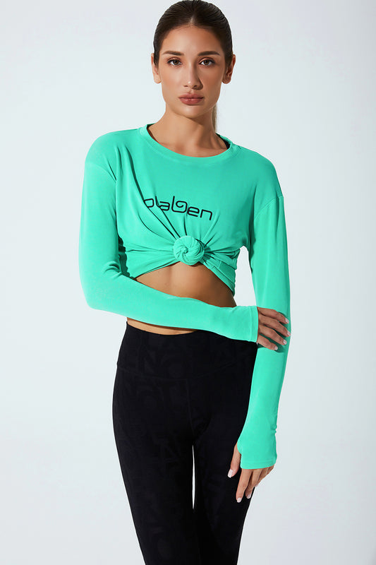 Stylish women's long sleeve top in downy green, perfect for a trendy and comfortable look.