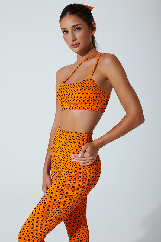 Vibrant orange polka dots bra for women, a stylish choice for a trendy look.